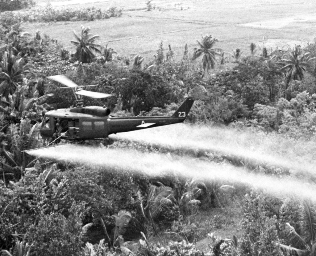 Spraying Agent Orange. Mekong Delta near Can Tho Defoliation Mission 336th Avn. Co. Stationed at Can Tho